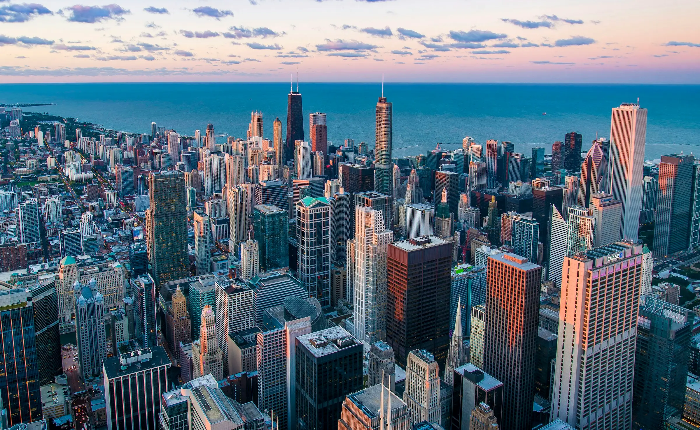 A dense city skyline photographed from above at dusk