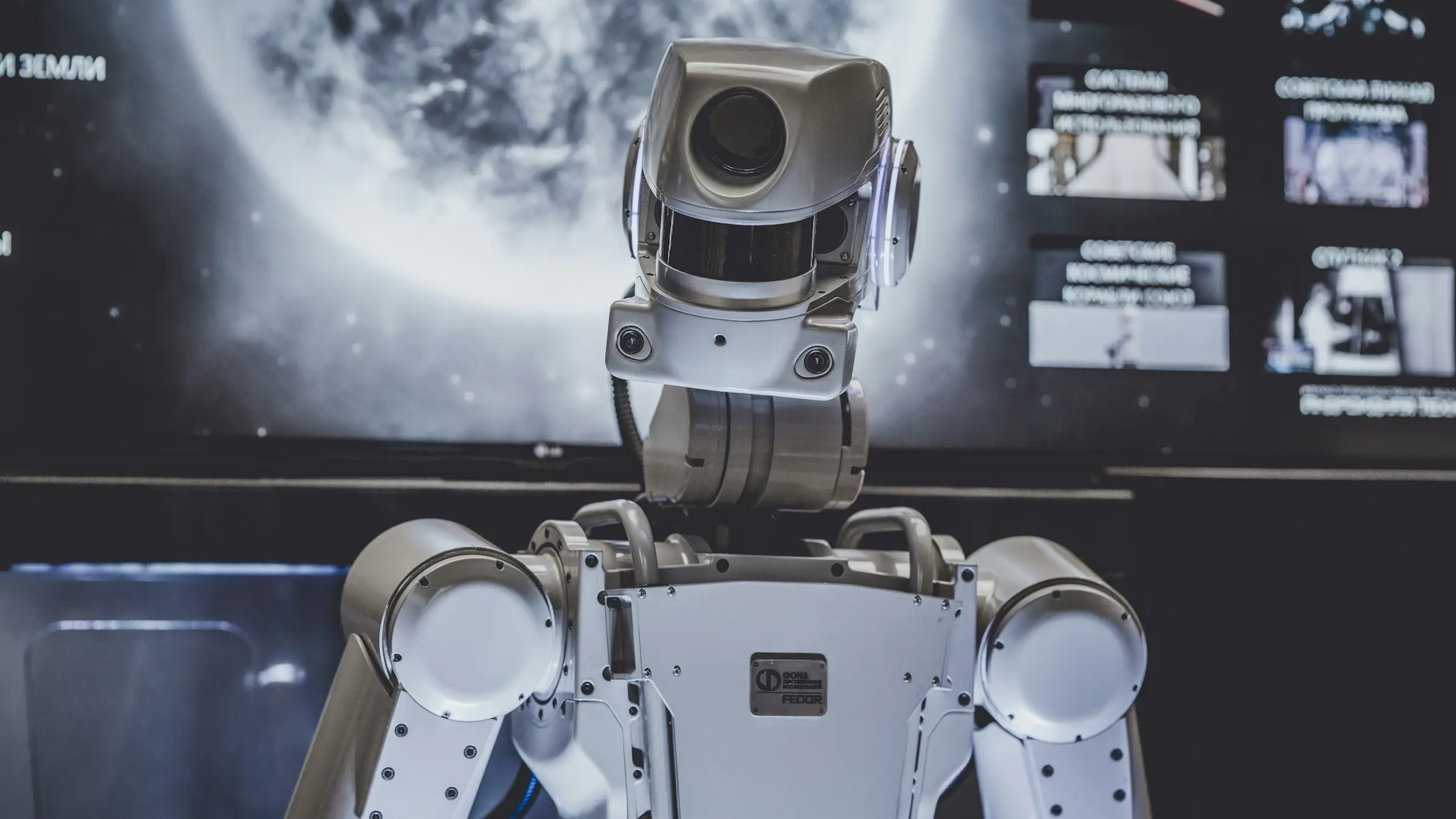 A humanoid robot under work lights in a test facility